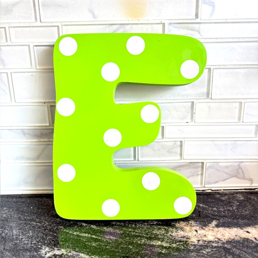 Tatutina wooden letter. Initial. E